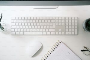 a keyboard and a mouse on a desk