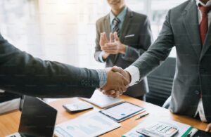 Business people shaking hands. Group of business successfully complete. The agreement and investment together in the mee