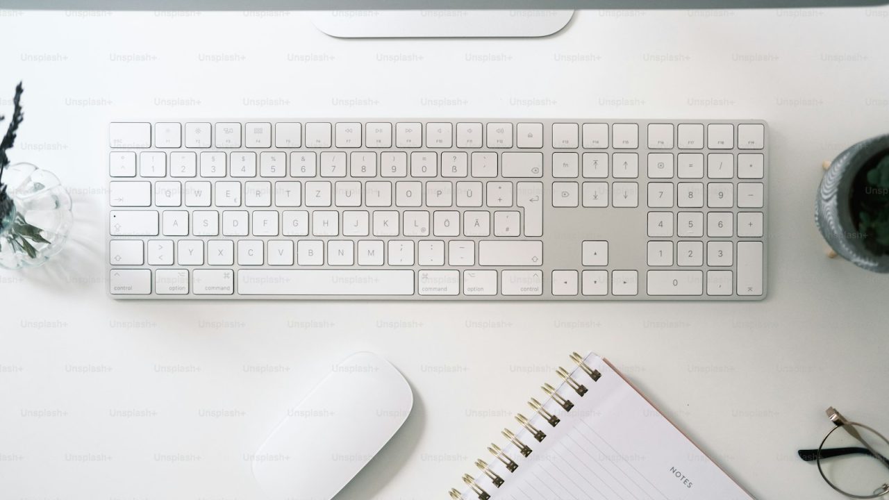 a keyboard and a mouse on a desk