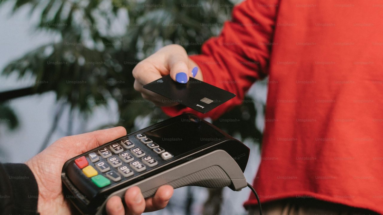 a person holding a remote control in their hand
