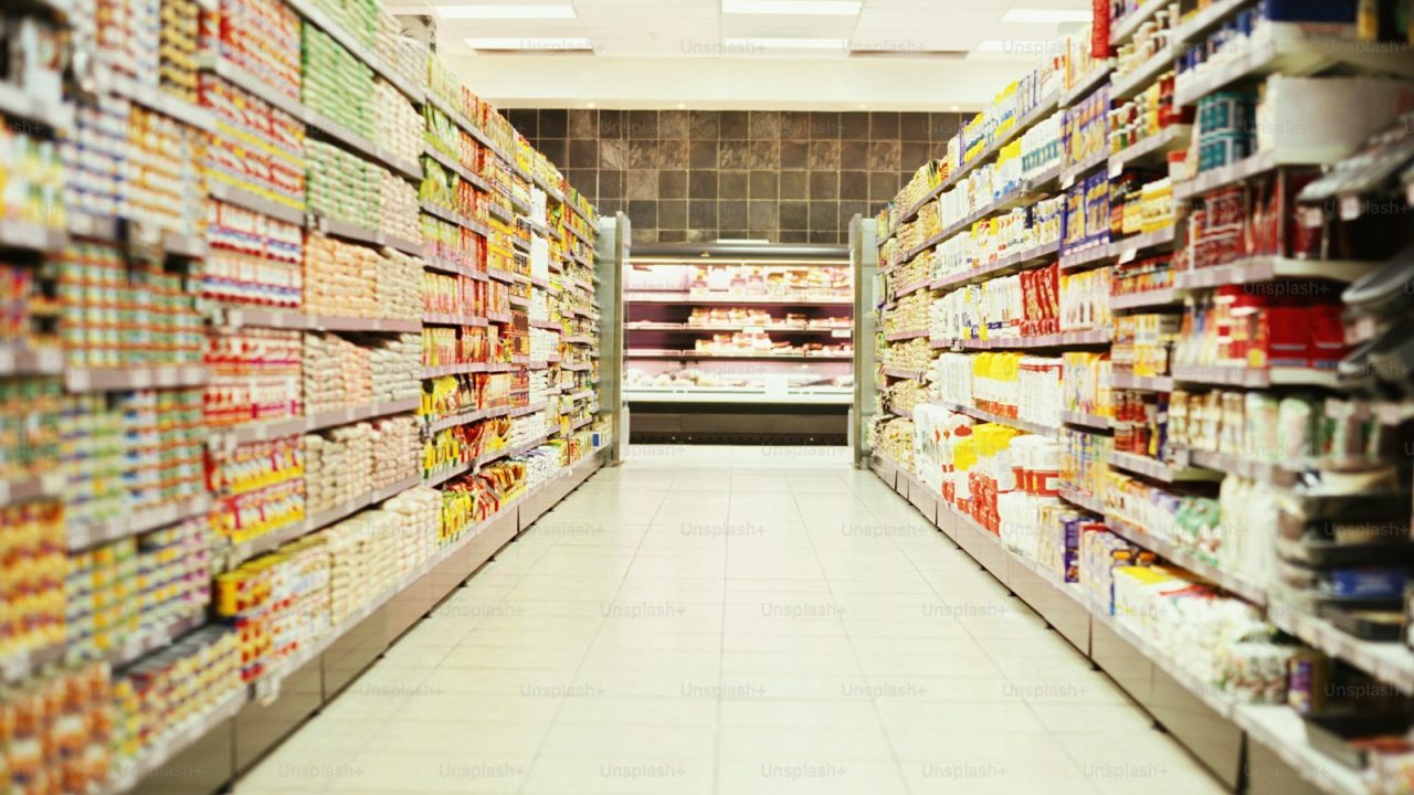a grocery store aisle filled with lots of food