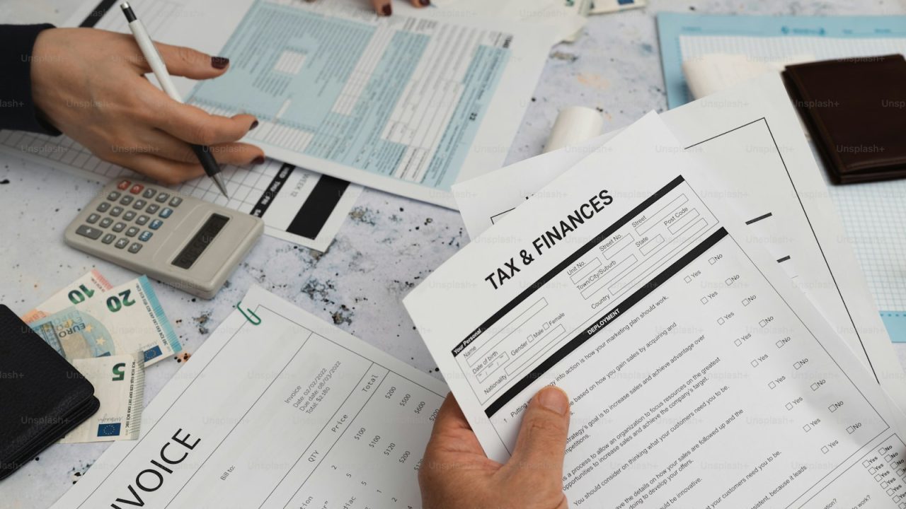 a person is filling in a tax form
