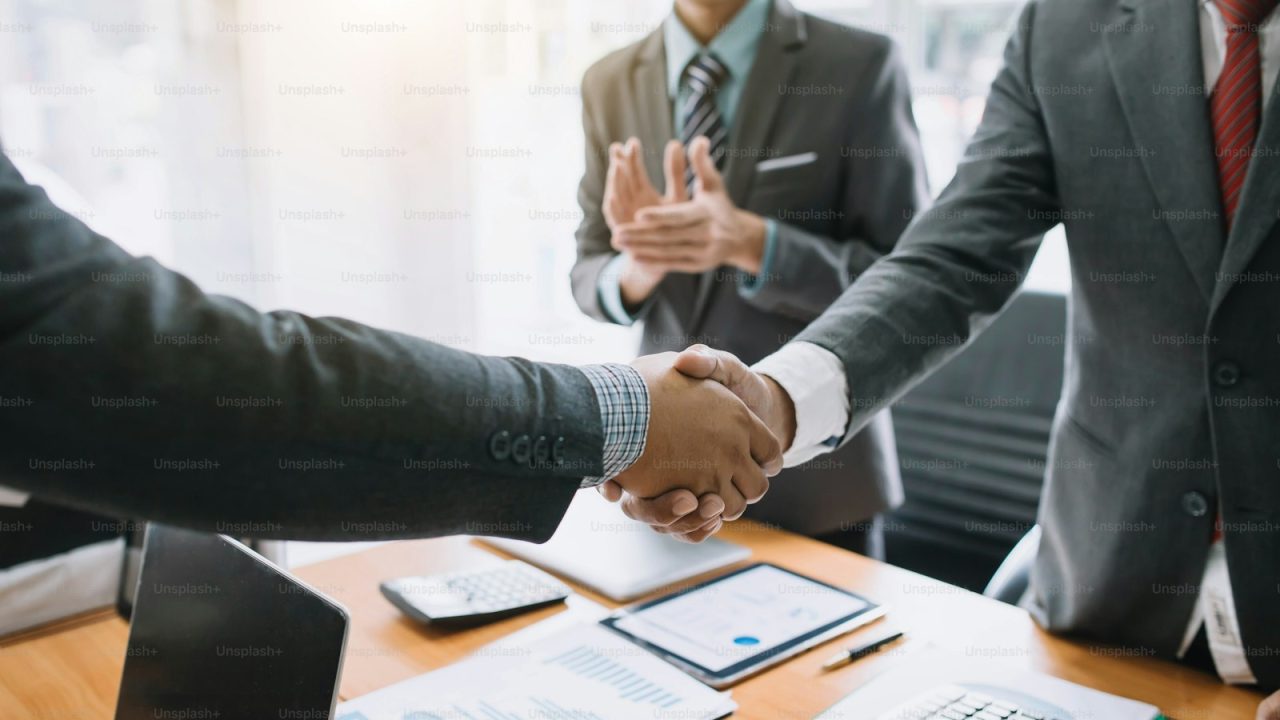 Business people shaking hands. Group of business successfully complete. The agreement and investment together in the mee