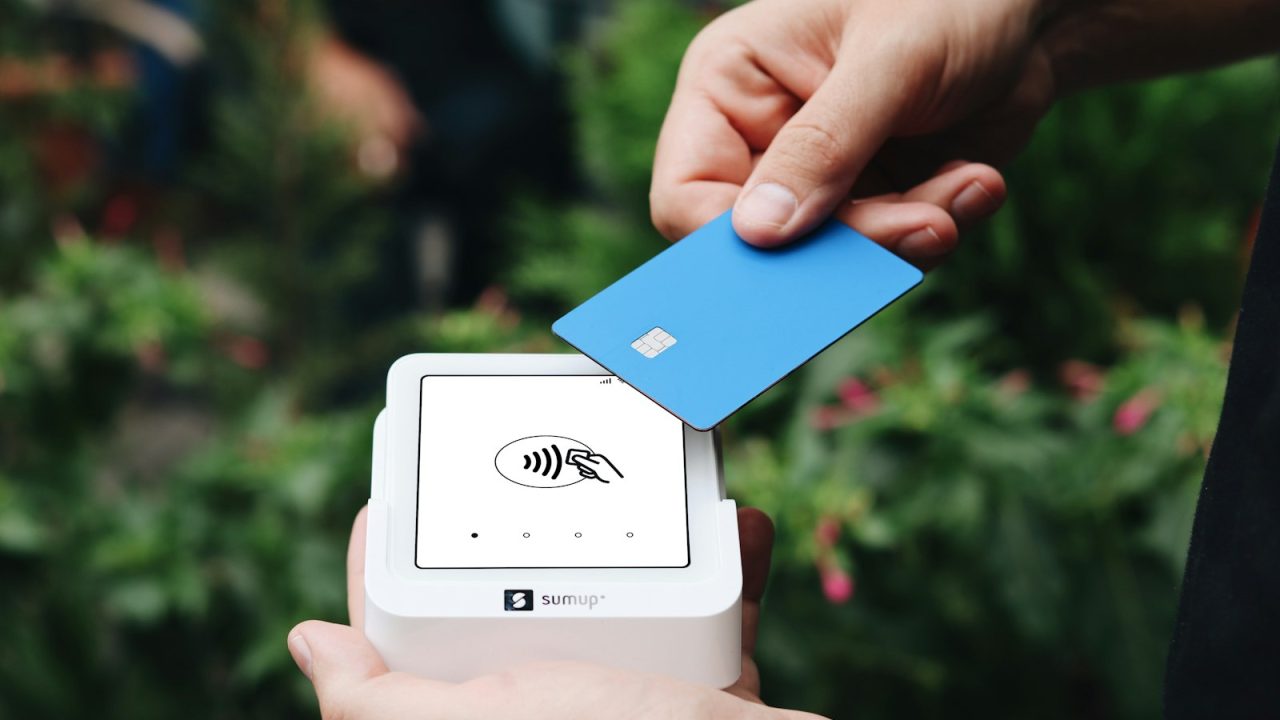 A person is holding a credit card in their hand