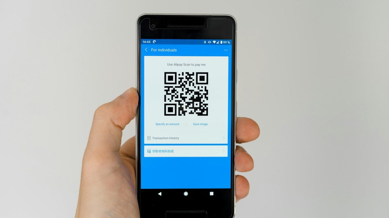 black android smartphone displaying qr code