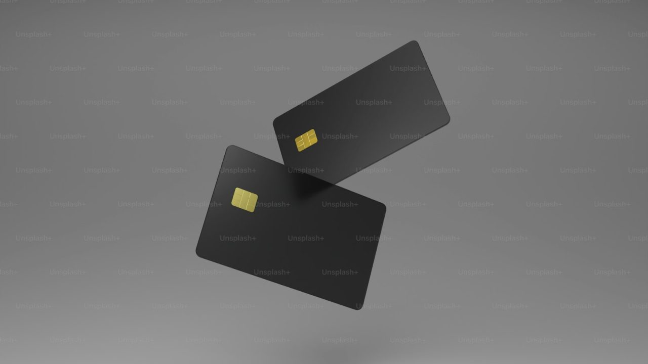 a black credit card flying through the air