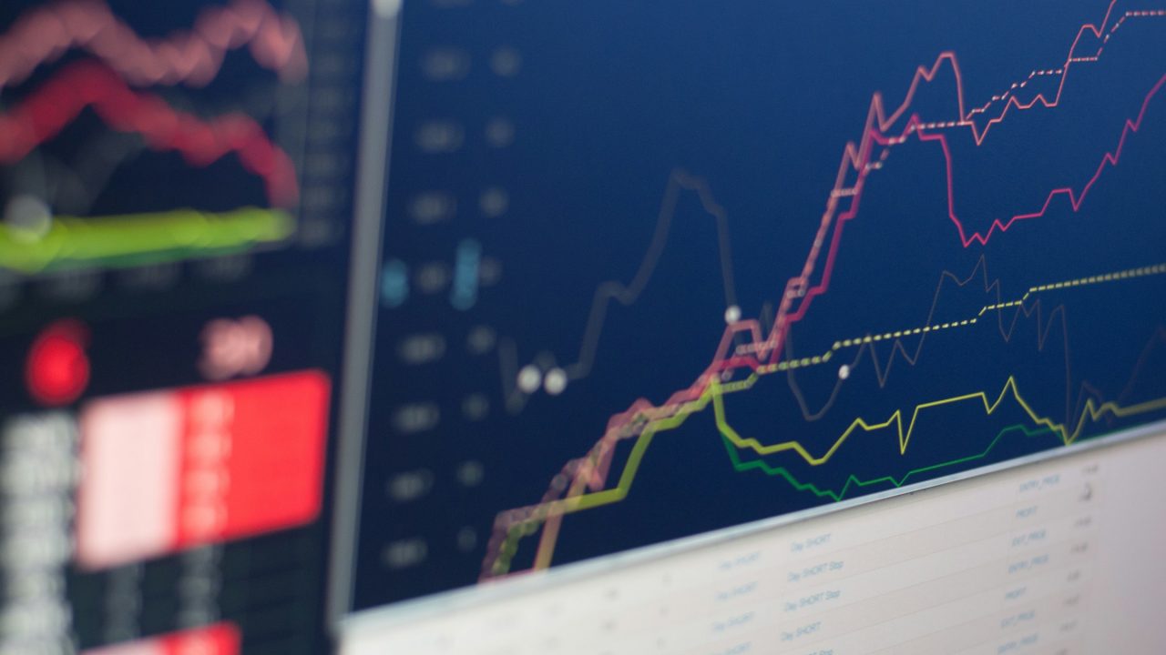 Business analytics dashboard comparing payment processing pricing models on a screen
